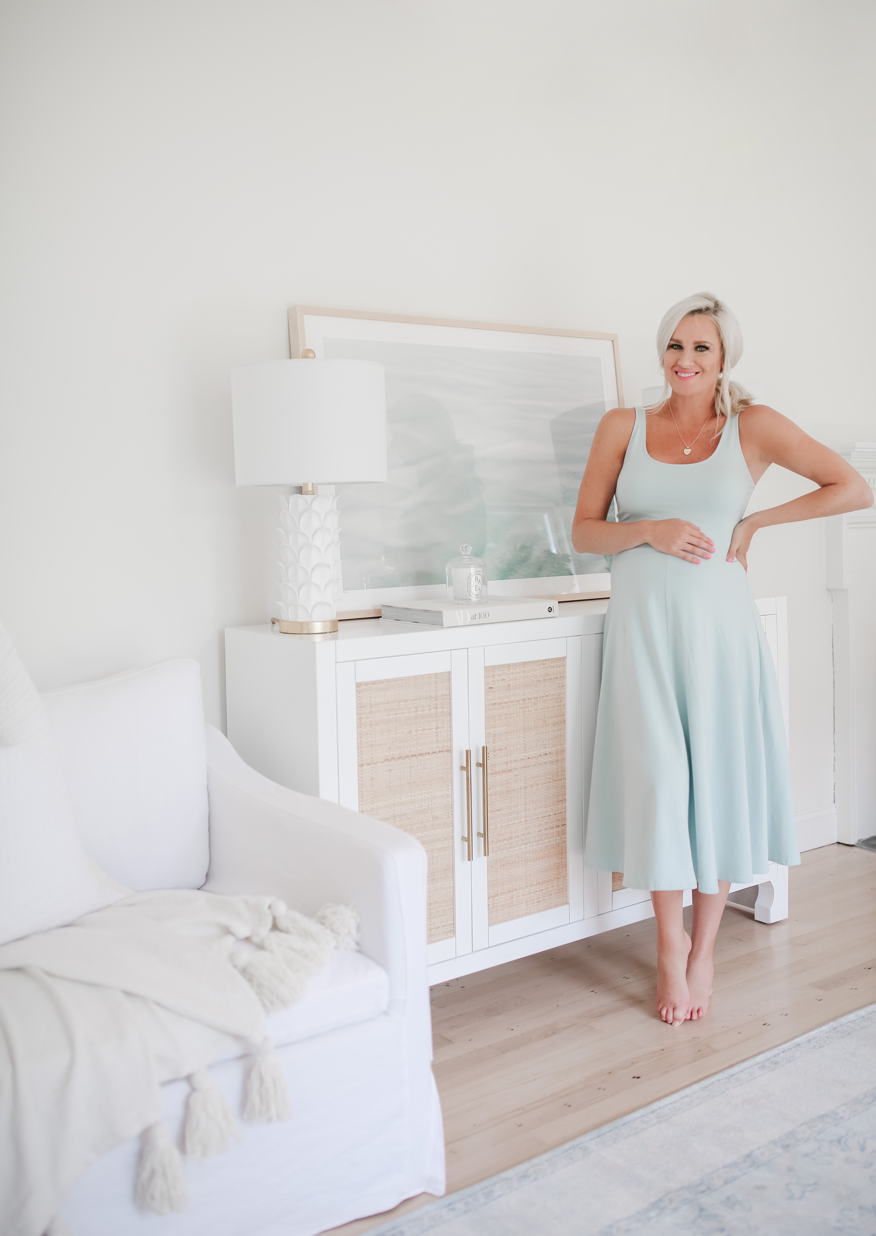 Light neutral living room and woman in a blue dress